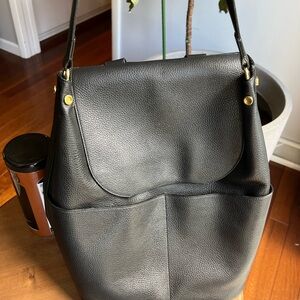 Cuyana black leather backpack. Great for traveling or going to work.
